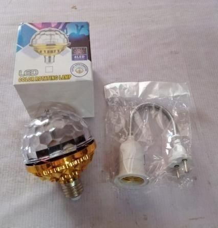 LED light bulb with packaging and adapter on a white surface