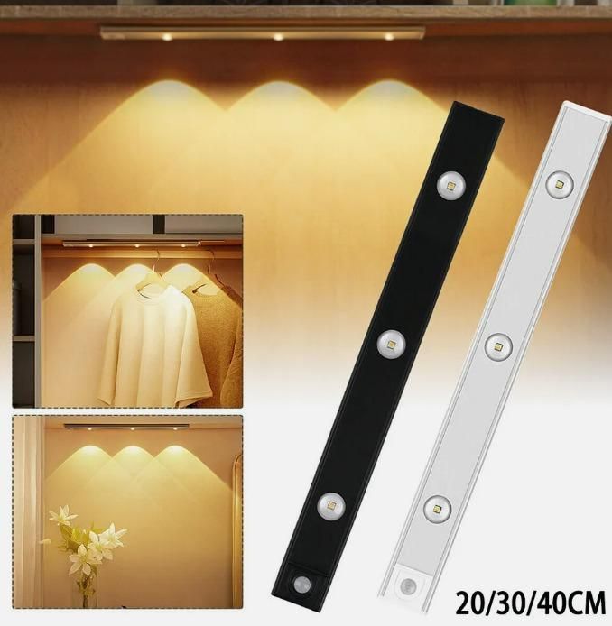 Under-cabinet LED light strips with a close-up of a cabinet interior illuminated by the lights.