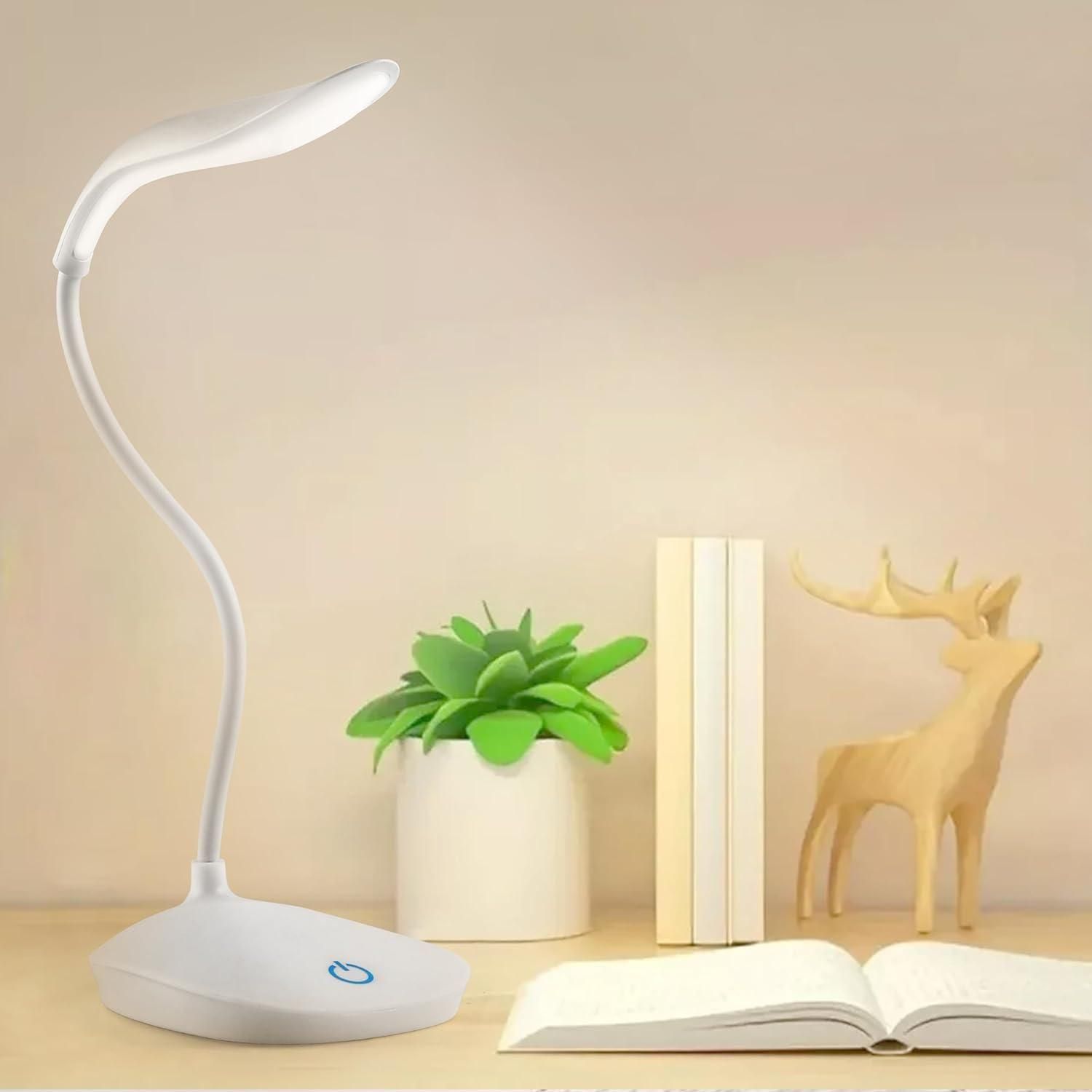 White LED desk lamp with a flexible neck on a study table