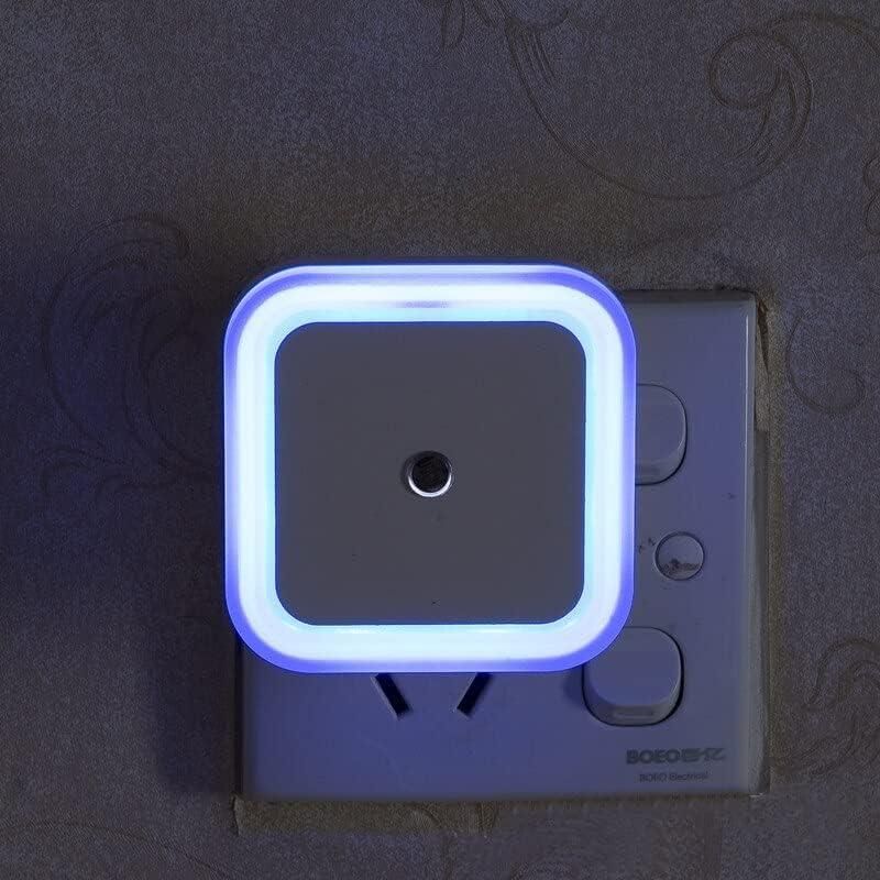 Neon light fixture on a wall socket with a dark background